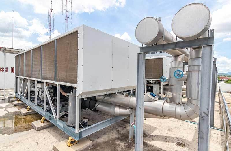 Air-cooled chiller unit with insulated piping for commercial chiller repair in Wilmington, NC