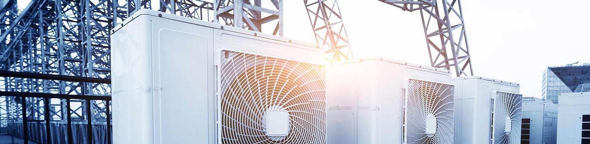 Industrial rooftop HVAC condenser units installed for commercial climate control in Wilmington, NC