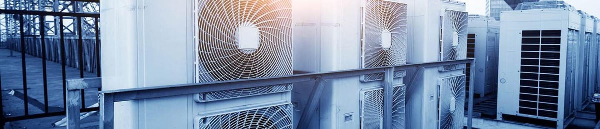 Row of rooftop fan coil units maintained by commercial HVAC Greensboro NC specialists