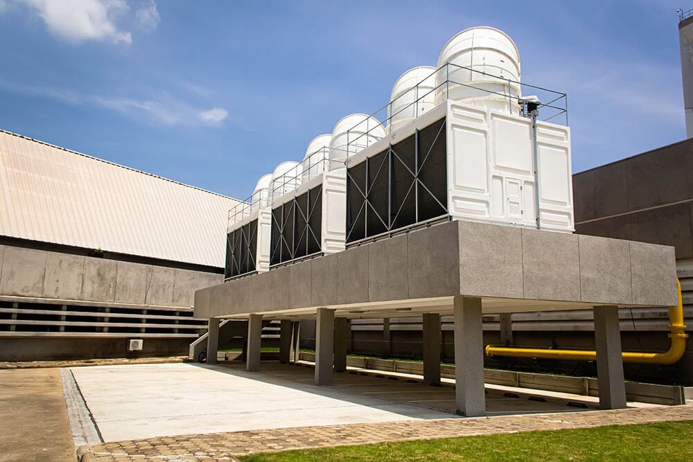 Large cooling tower on concrete platform for industrial HVAC services in Greensboro, NC